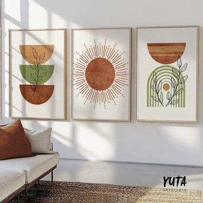Abstract terracotta and green geometric prints in wood frames as a three-piece gallery above a sofa