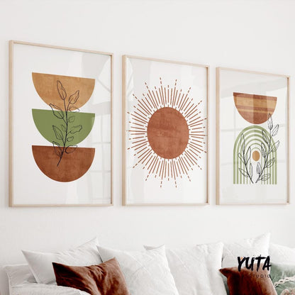 Three mid-century modern boho prints in light wood frames hung above a white sofa