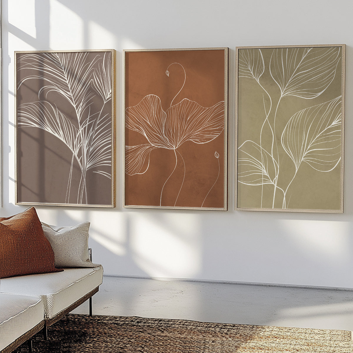 Earthy floral wall art set featuring minimalist botanical line drawings in terracotta, sage green and warm taupe.