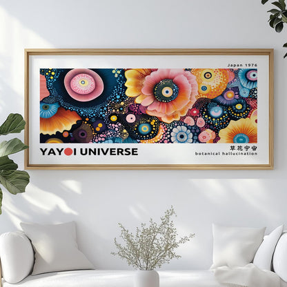 Large abstract floral artwork with colorful dotted flowers in a light wood frame above a sofa