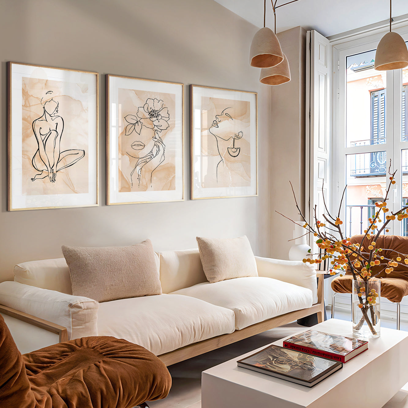 Neutral gallery wall featuring contemporary feminine line drawings and floral artwork