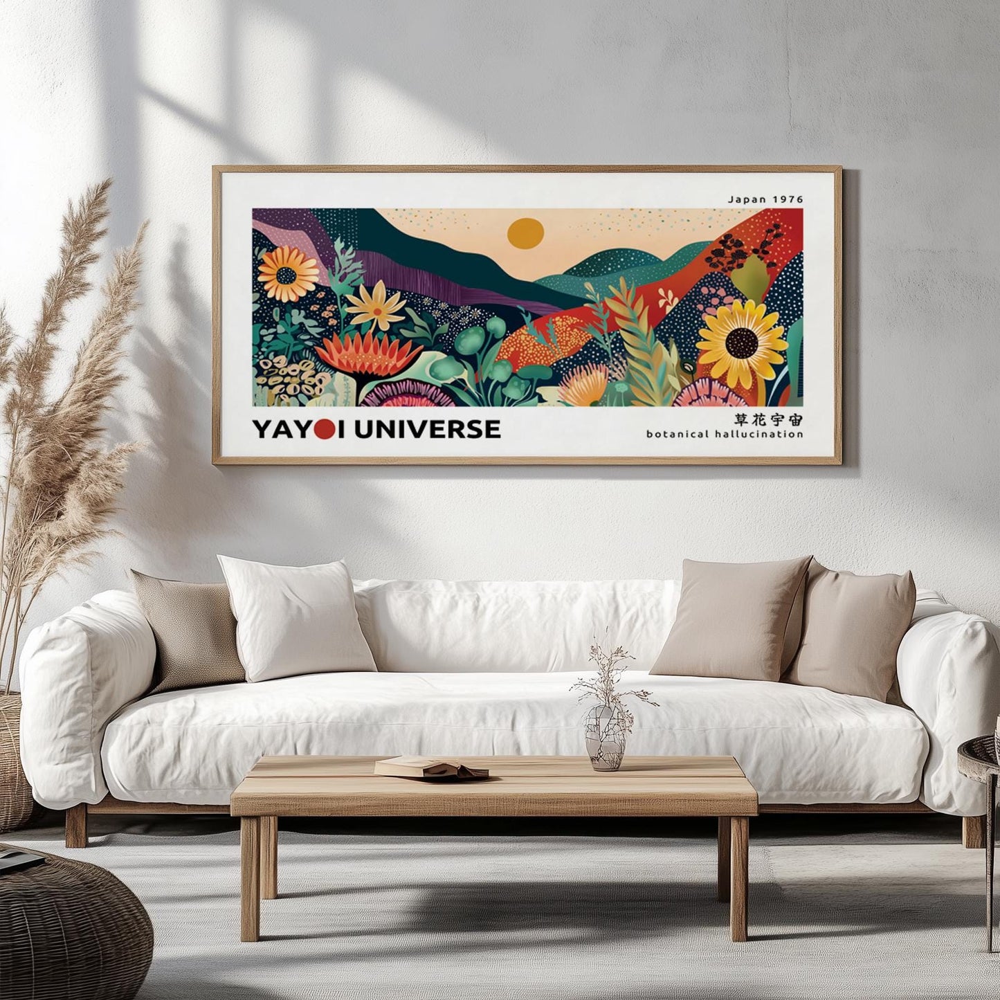 Large framed botanical landscape print in color displayed above a white sofa on a neutral wall