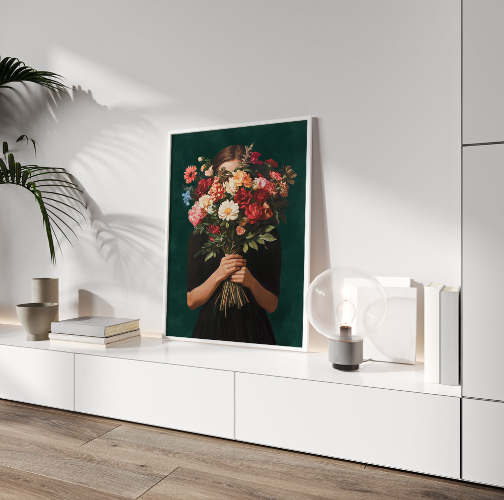 Floral woman portrait wall art with a large bouquet covering her face against a dark green background