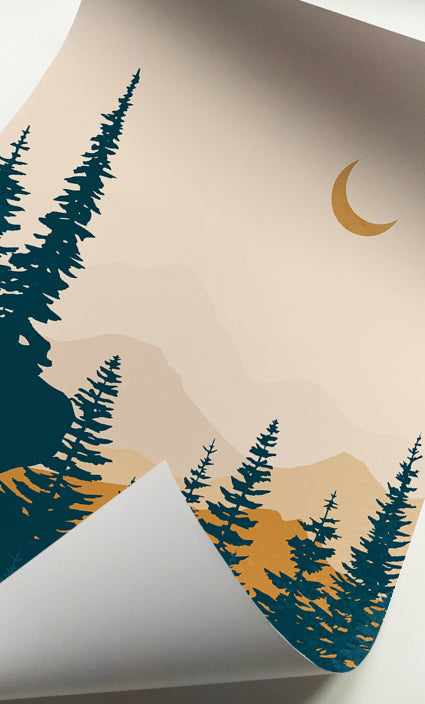 Layered mountain artwork with evergreen trees and golden sunrise