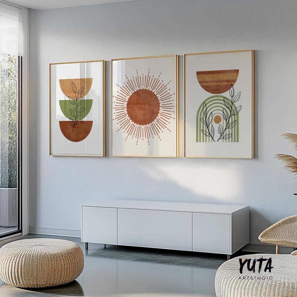 Set of three framed mid-century boho abstract prints above a modern white console.
