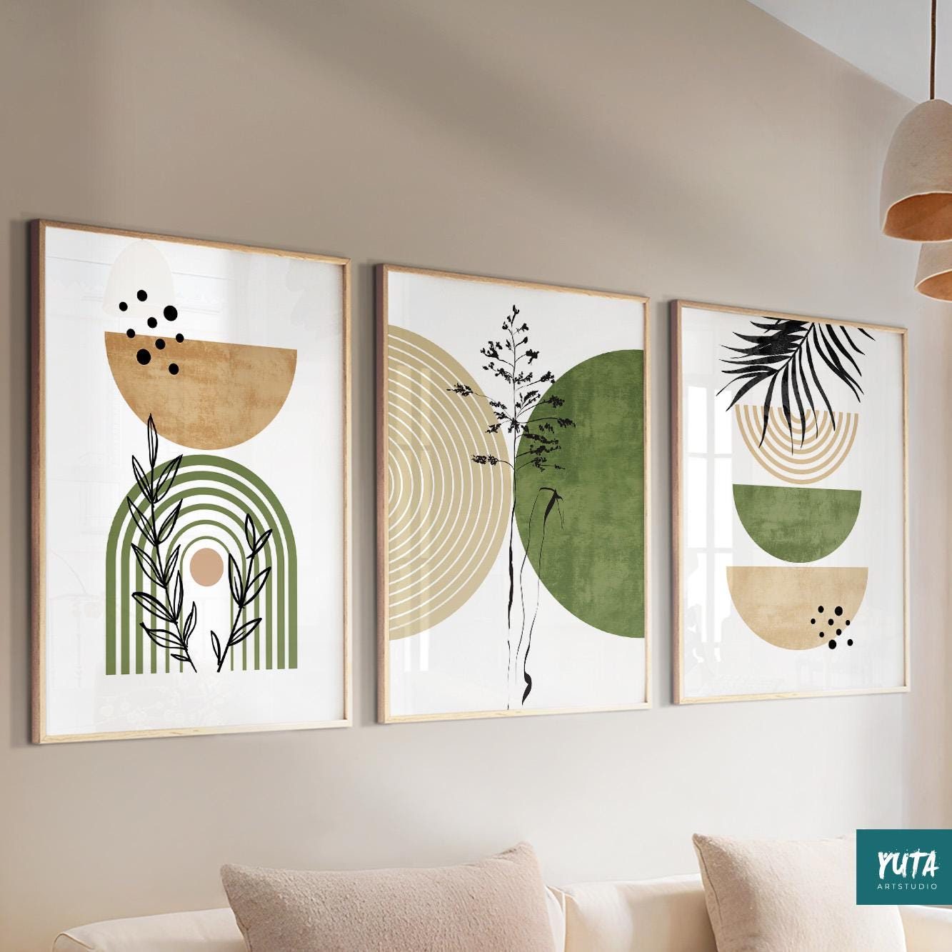 Three framed abstract boho prints with green, beige, and black shapes above a light console.