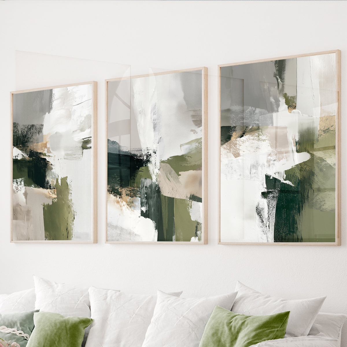 Green abstract wall art set of 3 featuring expressive brushstrokes in olive, forest green, white, beige and soft gray.