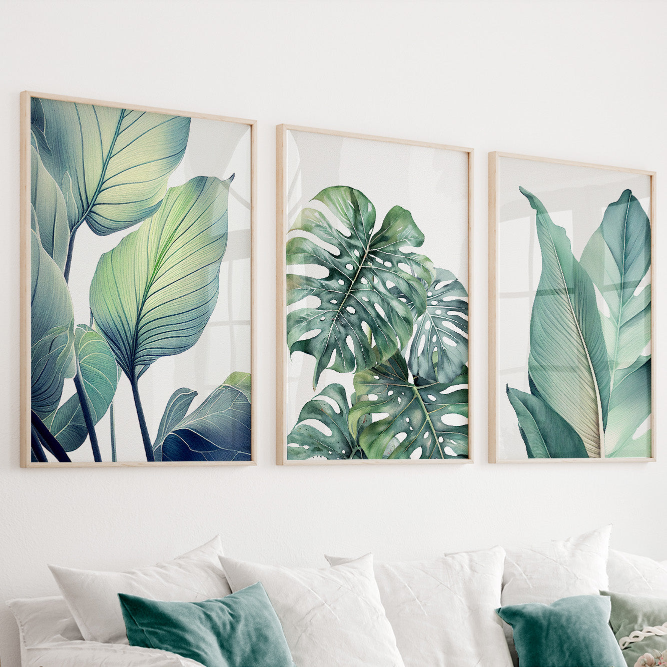 Green botanical wall art set of 3 featuring tropical leaves in soft sage green and eucalyptus tones