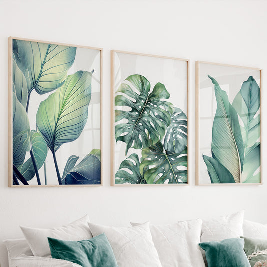 Green botanical wall art set of 3 featuring tropical leaves in soft sage green and eucalyptus tones
