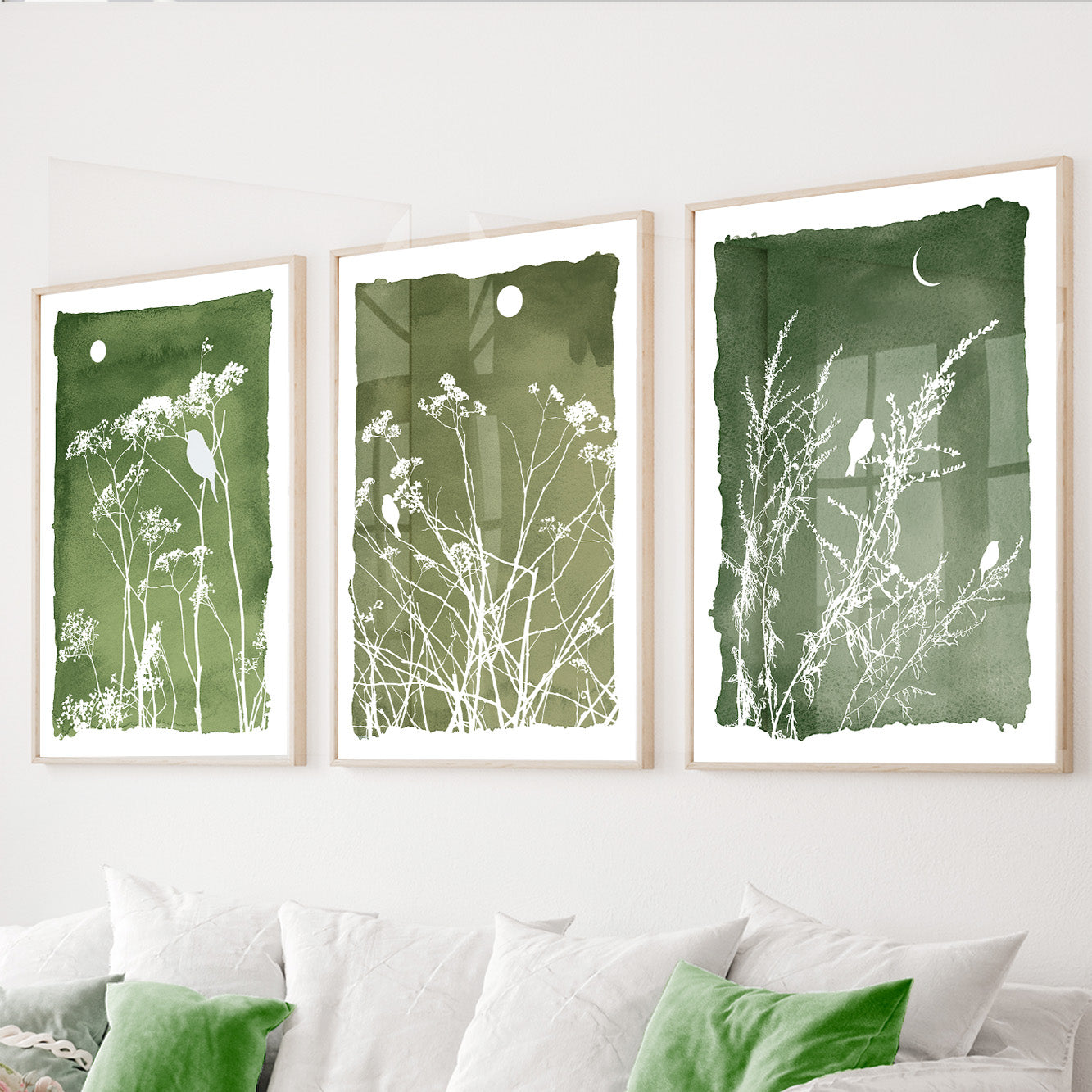 Green botanical wall art set of 3 featuring wildflowers and perched birds on sage green backgrounds