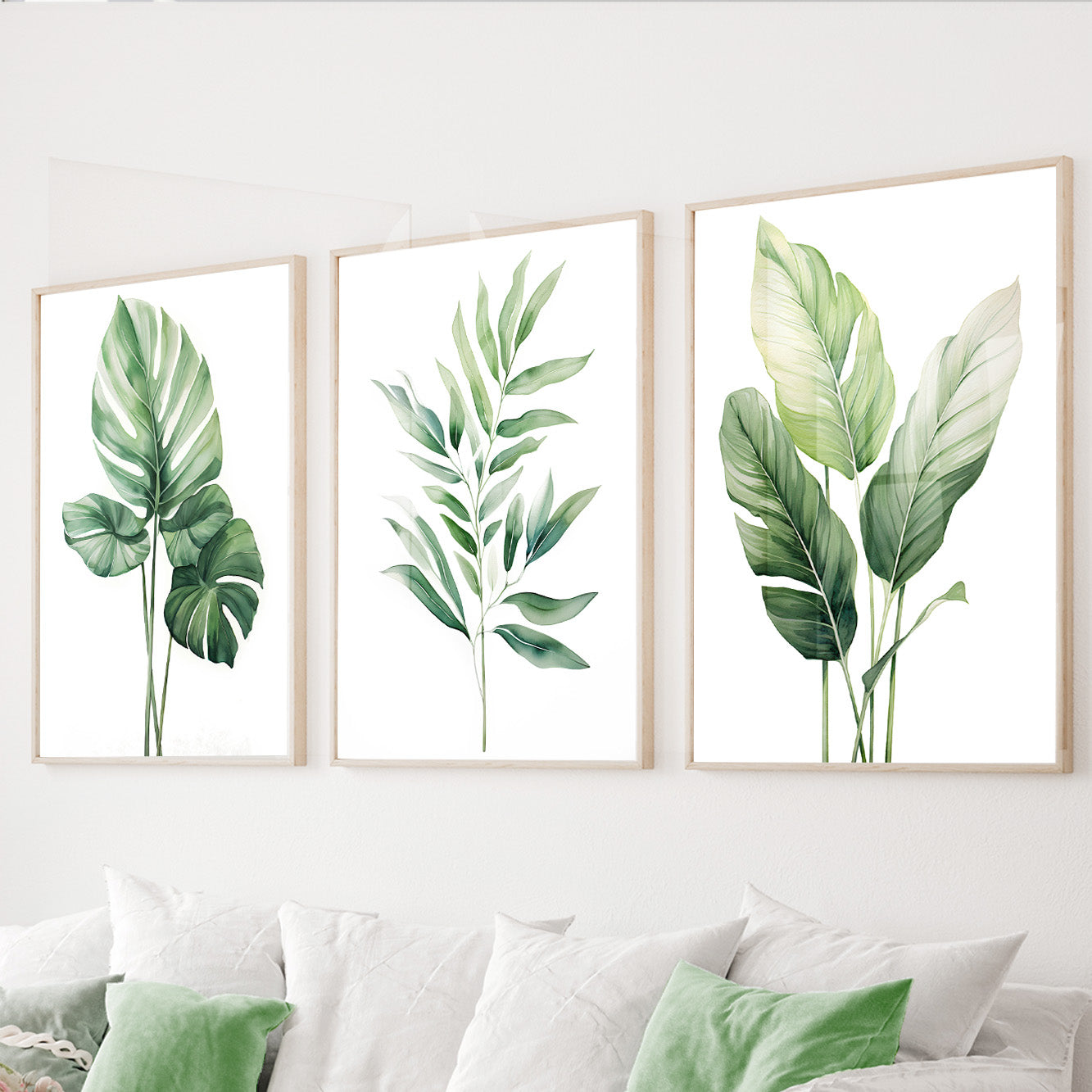 Green botanical wall art set of 3 featuring tropical monstera and banana leaves in soft watercolor tones