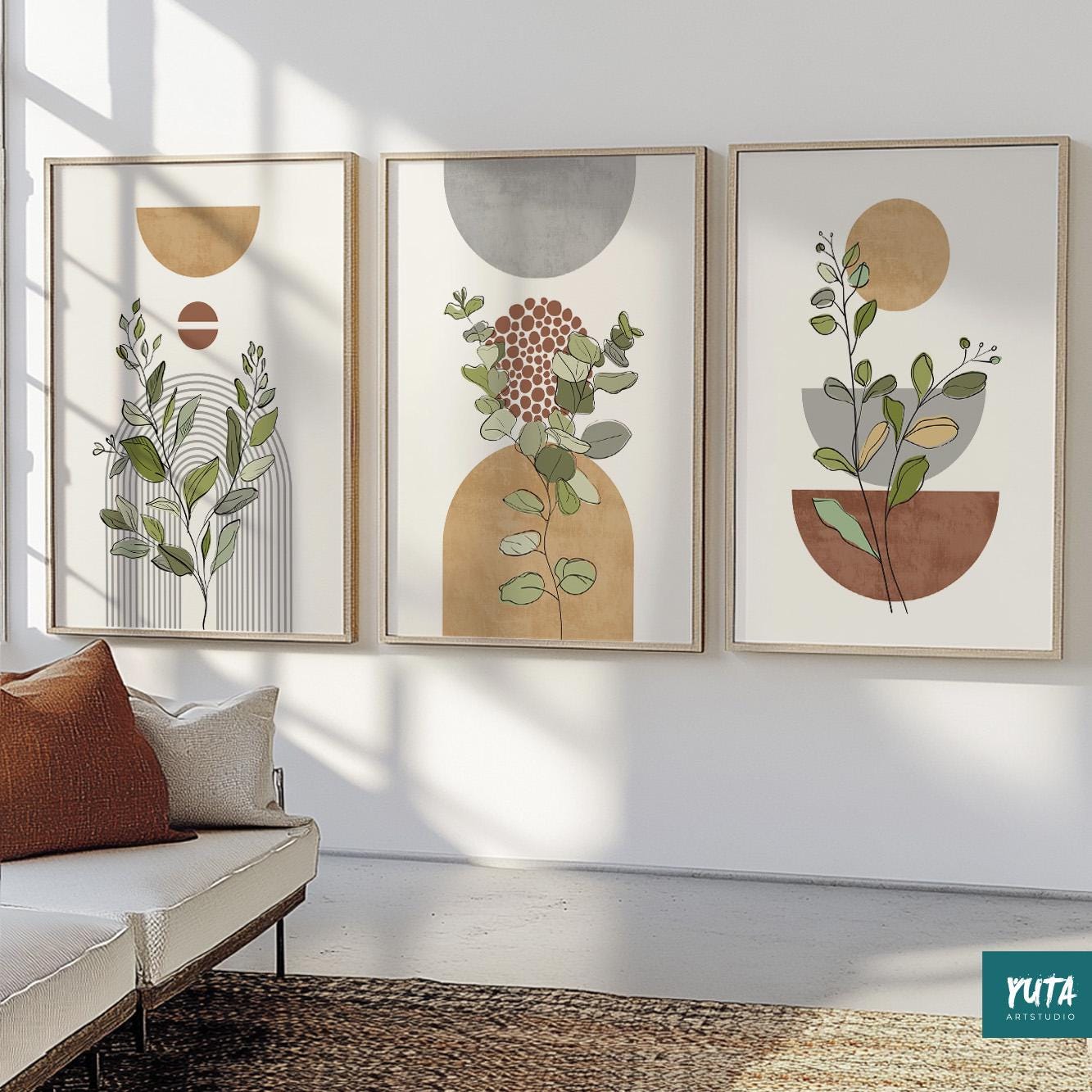 Abstract botanical prints in natural wood frames displayed as a trio in sunlight