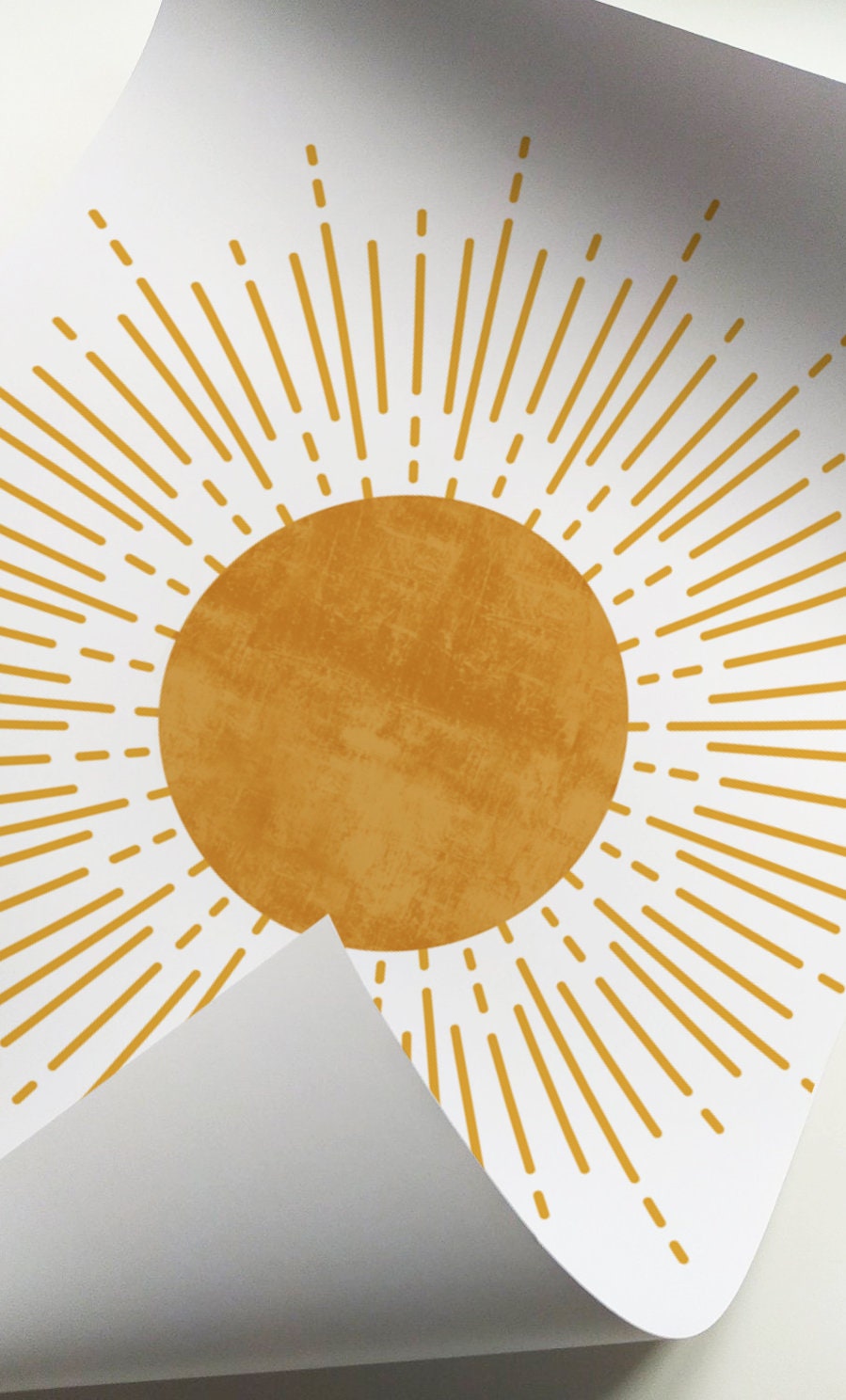 Print size reference showing unframed mid-century sunburst artwork with curled corner