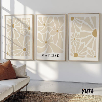 Neutral beige Matisse-inspired floral art trio in minimalist wood frames on a sunlit wall