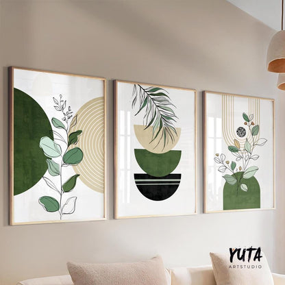 Abstract botanical prints with green and black shapes in light wood frames, displayed as a trio.