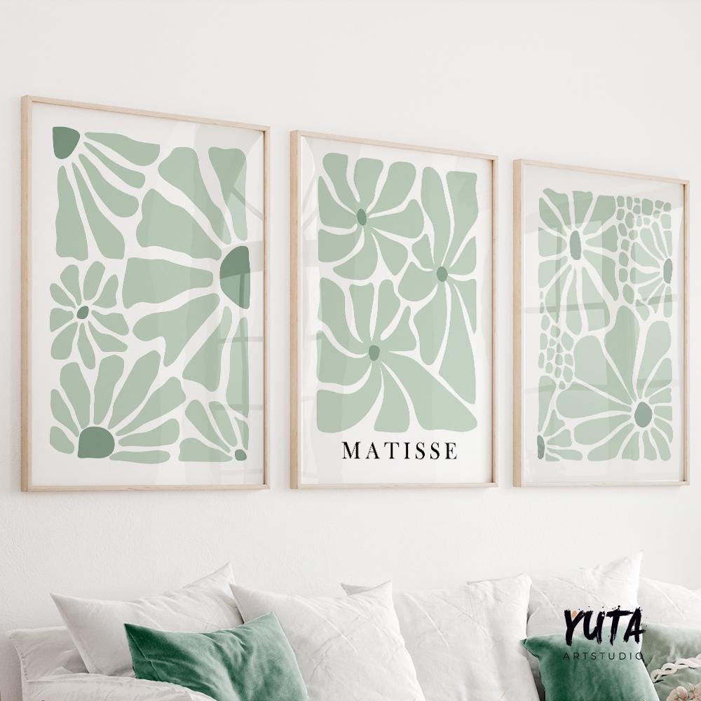 Set of three minimalist sage green floral prints with abstract Matisse-inspired shapes in light wood frames
