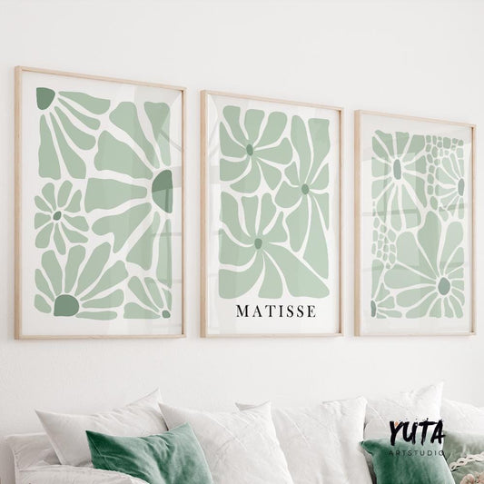 Set of three minimalist sage green floral prints with abstract Matisse-inspired shapes in light wood frames