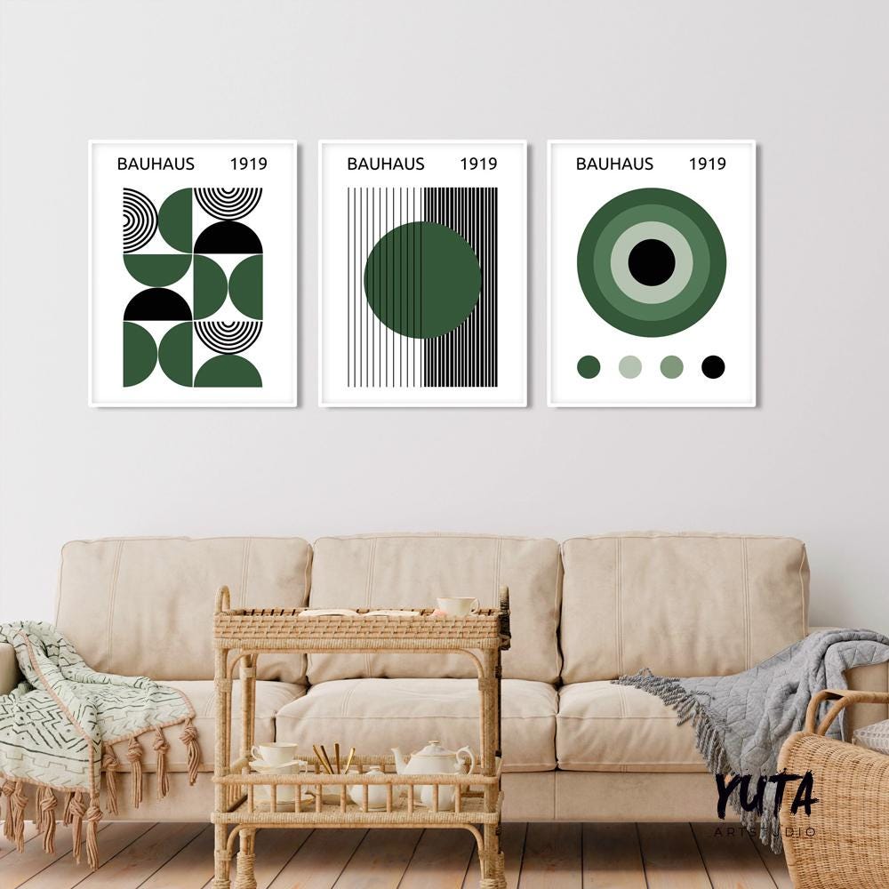 Geometric Bauhaus prints in green and black, framed as a set of three above a cream sofa