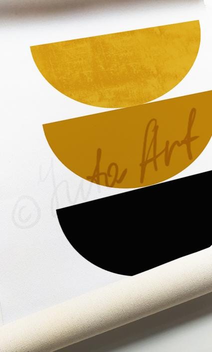 Close-up of abstract boho wall art print with stacked yellow and black half-circles