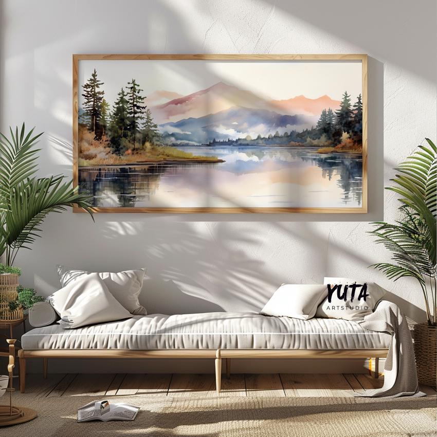 Pastel mountain landscape watercolor in a natural wood frame above a cushioned bench