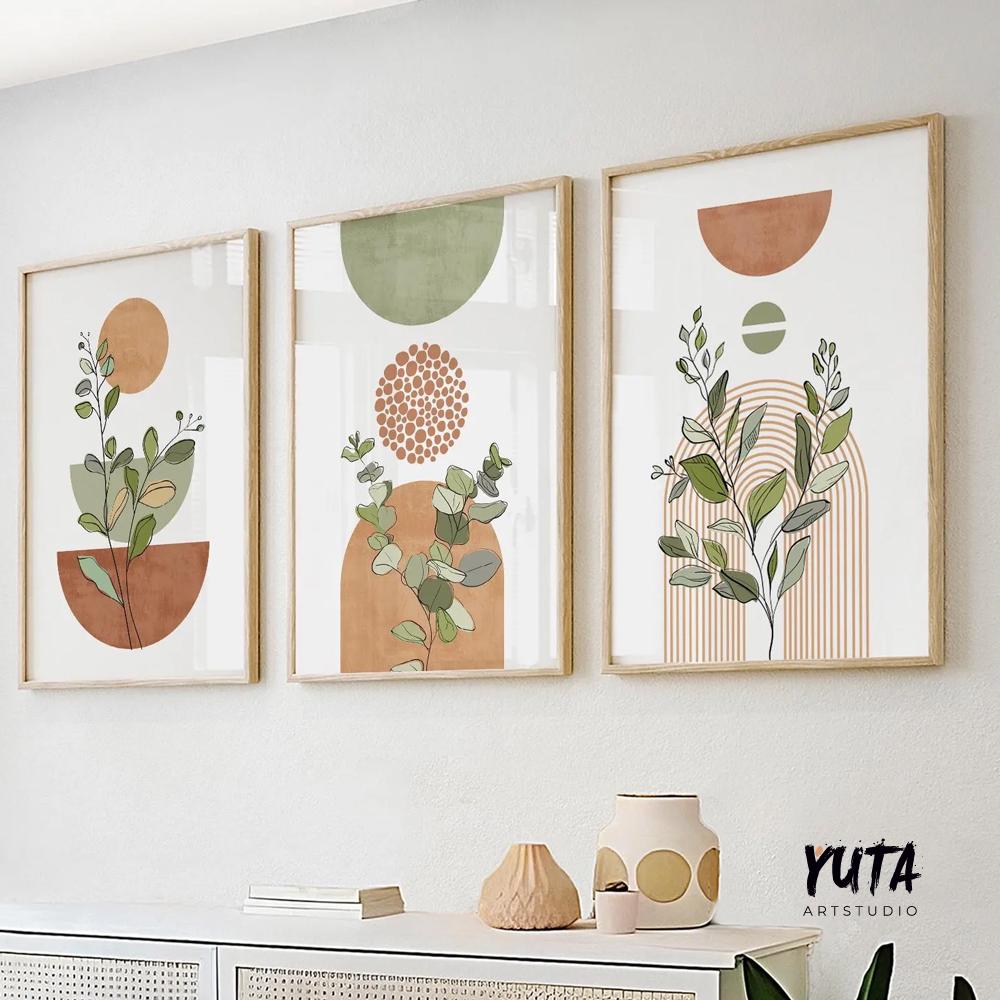 Three framed botanical boho prints with terracotta and sage shapes in soft daylight