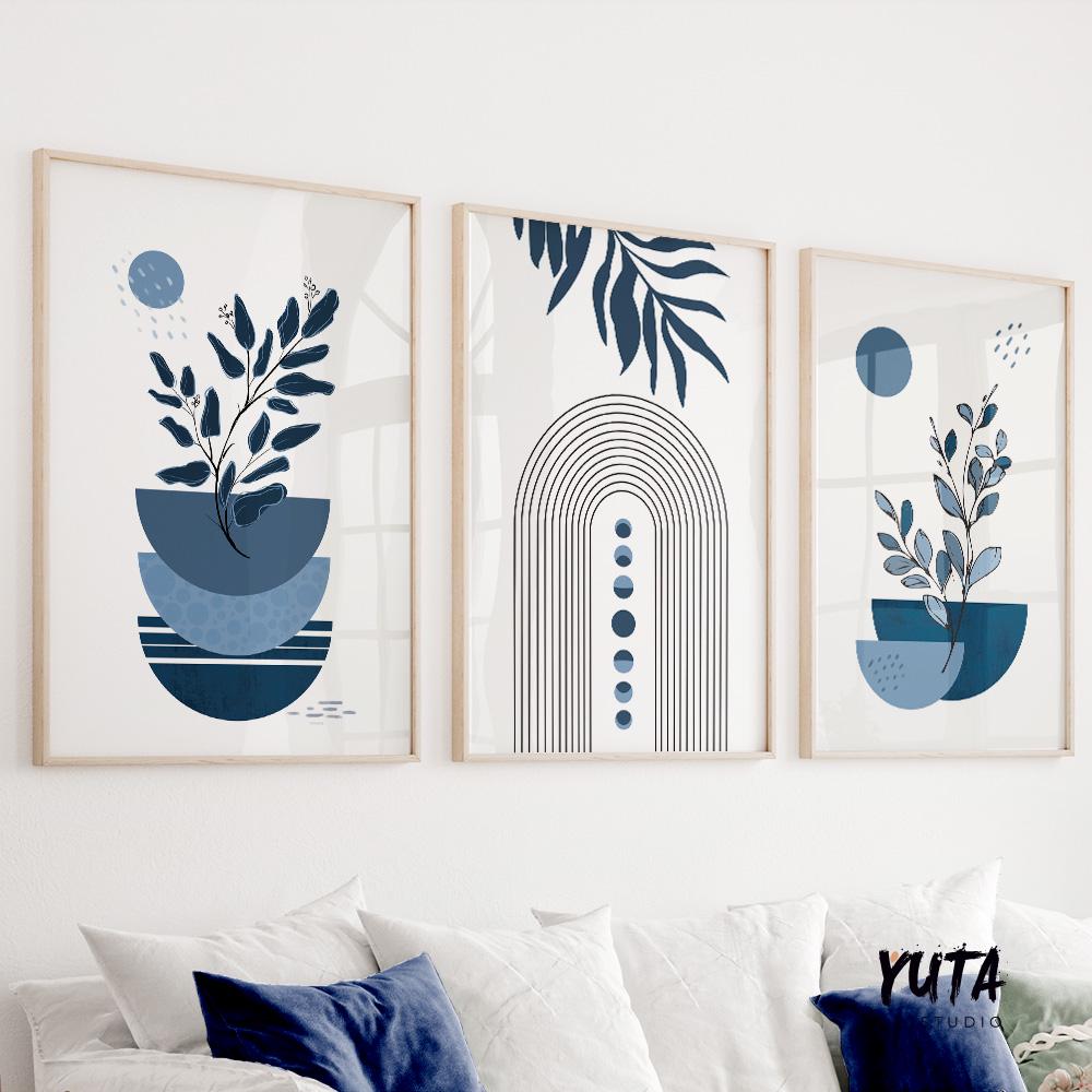 Abstract botanical shapes and minimalist arches in navy blue, framed as a three-piece wall set.