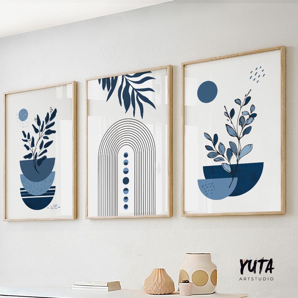 Three navy blue boho abstract prints with botanical and geometric motifs in light wood frames