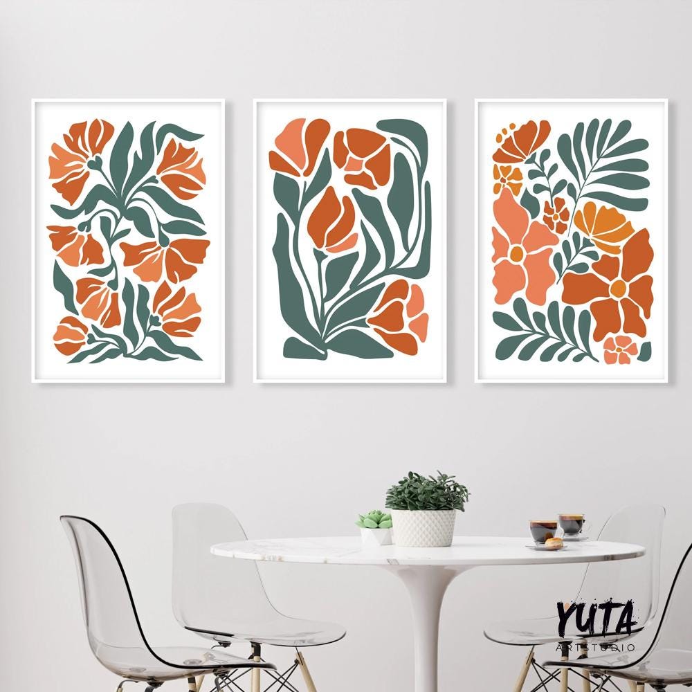 Trio of framed terracotta floral prints in a minimalist style above a white round table