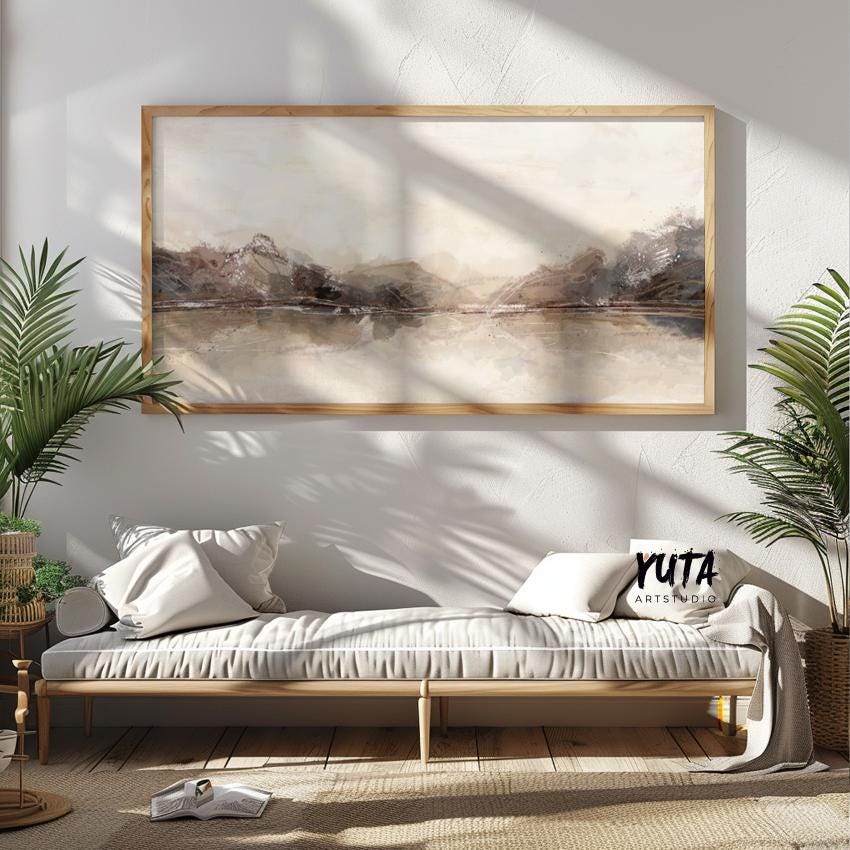 Framed neutral abstract landscape print displayed above a daybed, ready for shipping.