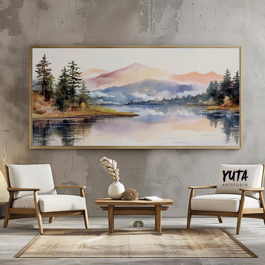 Pastel mountain landscape artwork in a light wood frame styled above a wooden console table