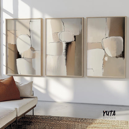 Textured neutral abstract triptych in light wood frames displayed as wall art set