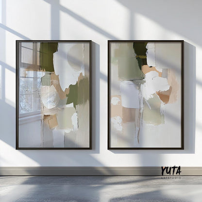 Set of two framed abstract brushstroke prints in olive, beige, and white above a sofa.