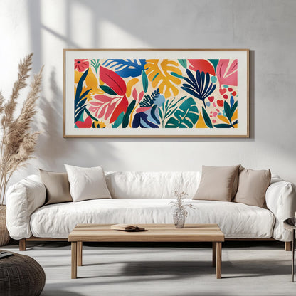 Panoramic abstract leaf artwork in a light wood frame displayed above a white sofa
