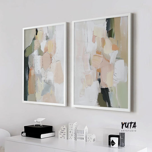 Two framed abstract pastel prints in pink and green above a white console, medium size shown