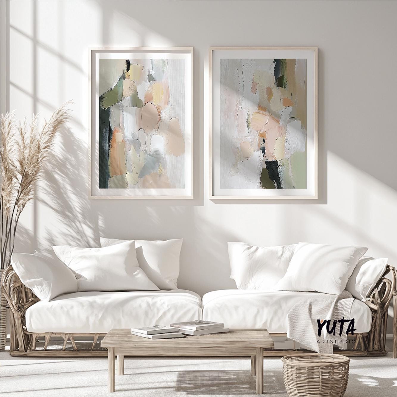 Abstract pastel brush stroke art pair in light wood frames above white sofas