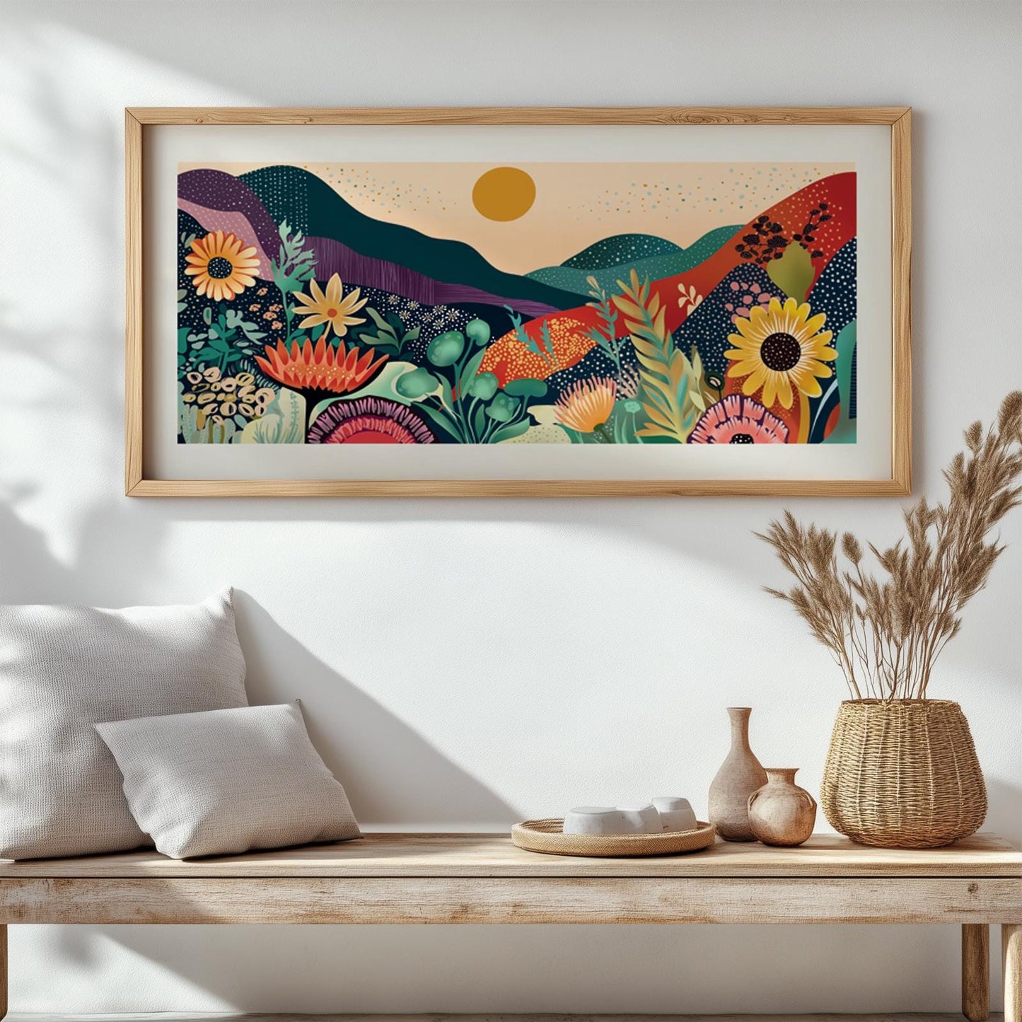 Framed abstract mountain and floral art hung above a wooden bench with neutral pillows.