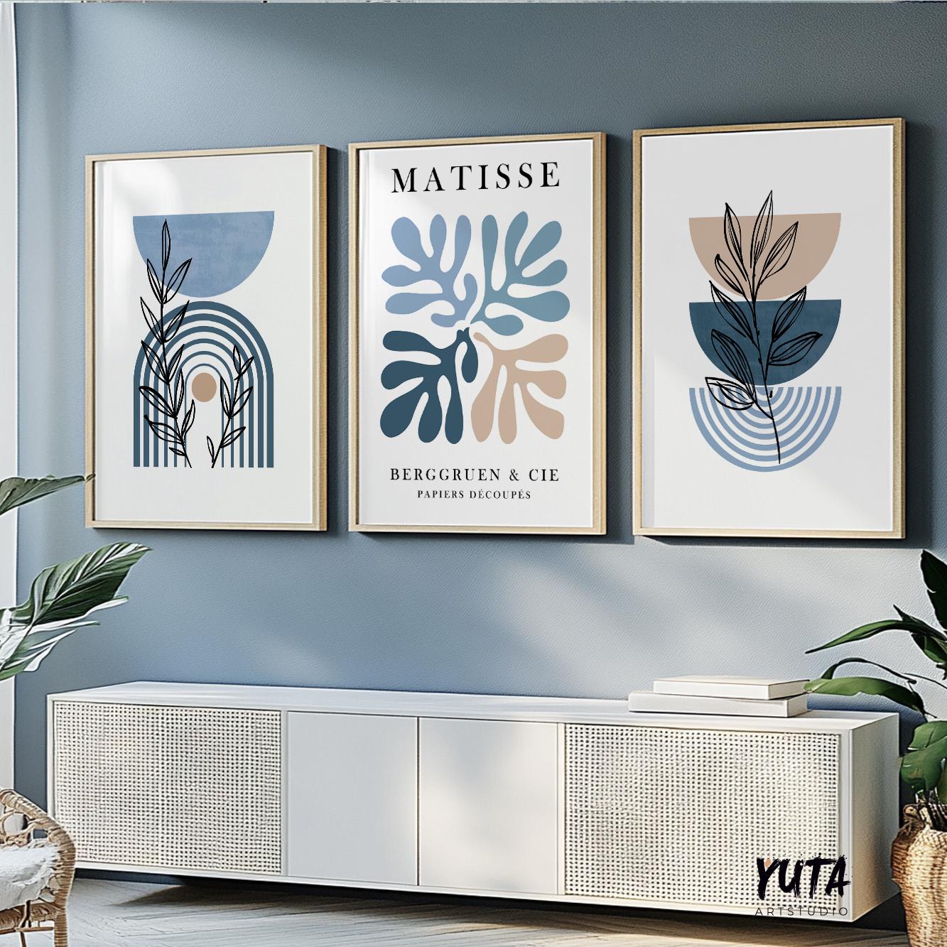 Mid-century blue and beige gallery wall art trio framed above a modern sofa unit