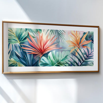 Tropical leaves watercolor artwork in a gold frame, hung on a bright white wall