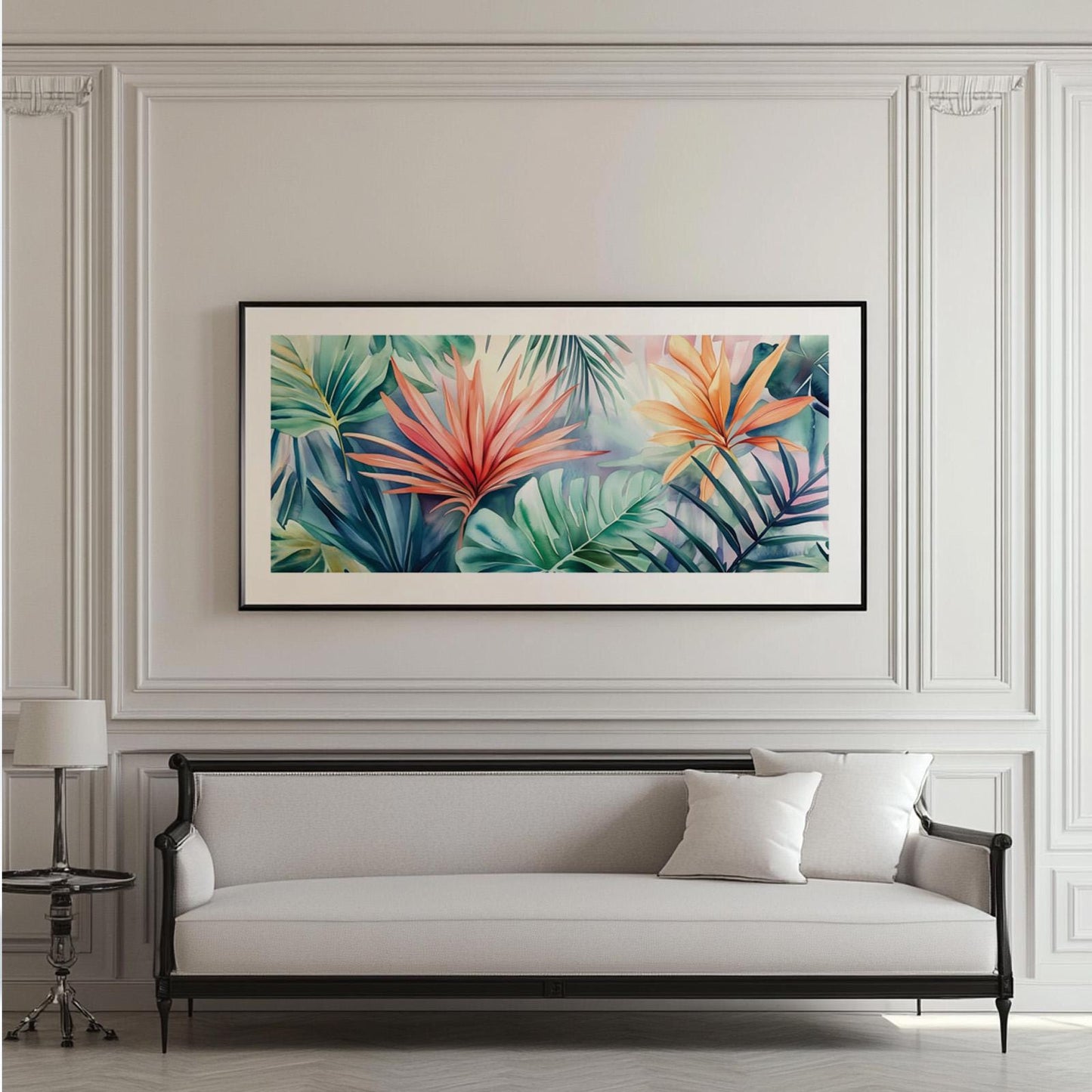 Framed panoramic tropical leaf artwork centered above a classic upholstered sofa