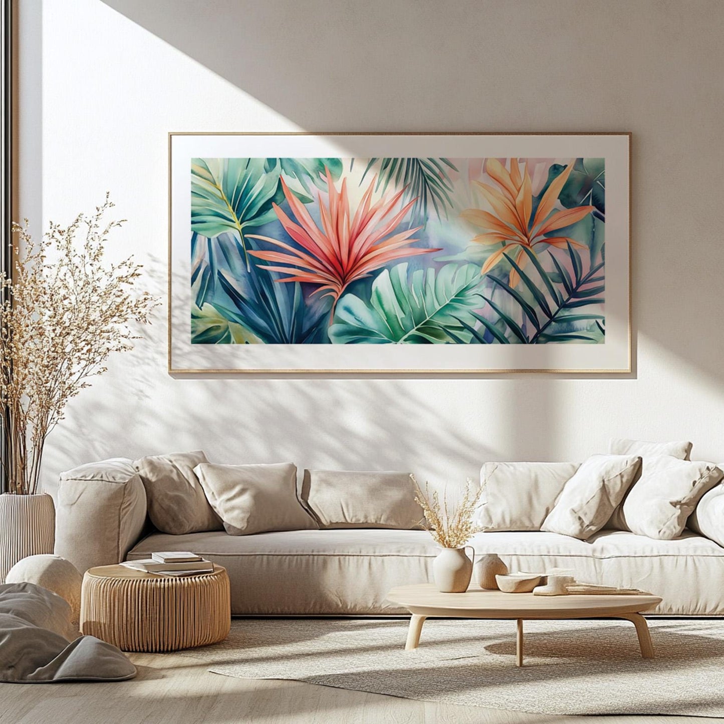 Framed panoramic tropical leaves artwork illuminated by natural light above a neutral sofa