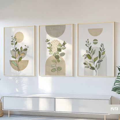 Trio of sage green botanical prints with geometric shapes in light wood frames above a console