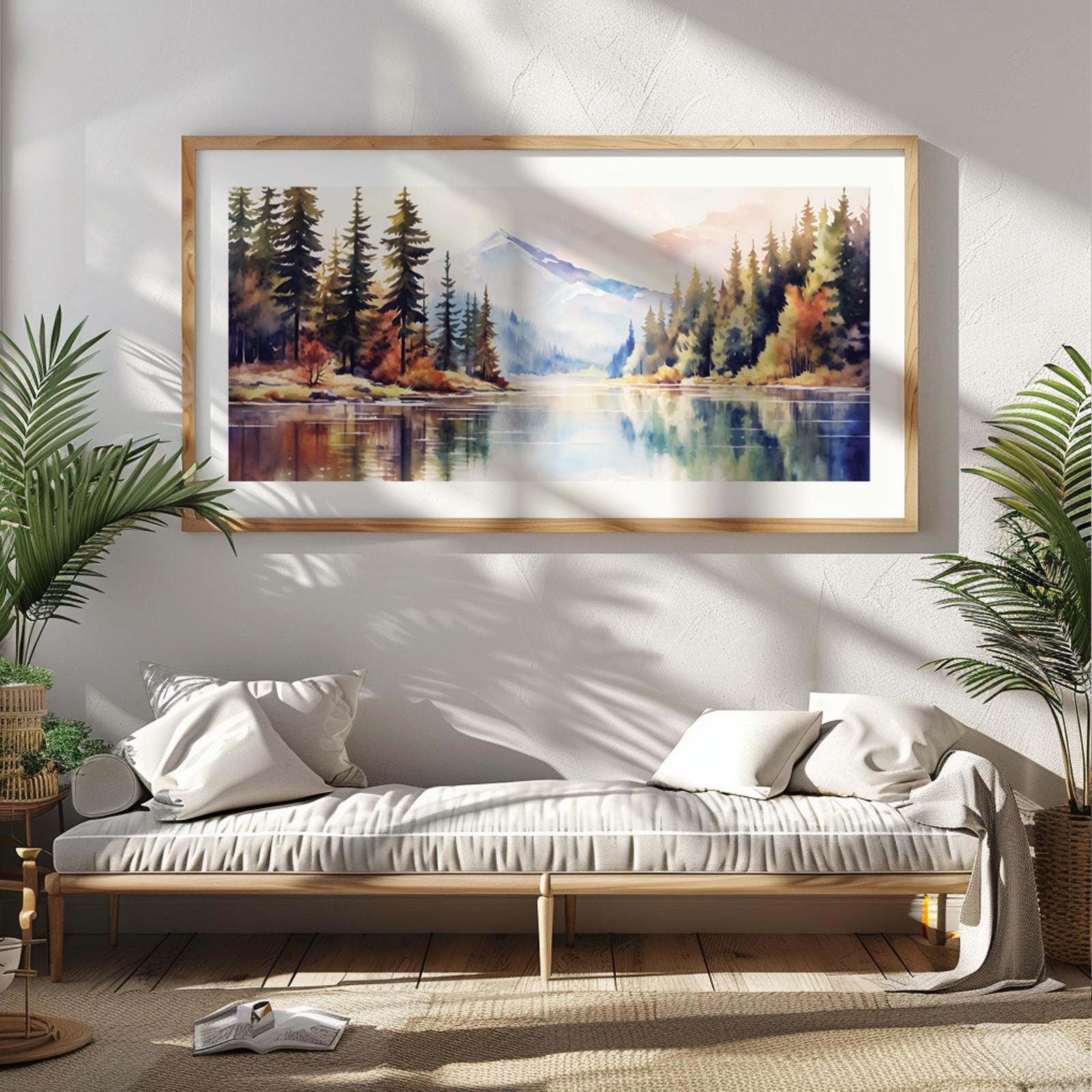 Panoramic framed mountain landscape print displayed above a daybed for scale reference