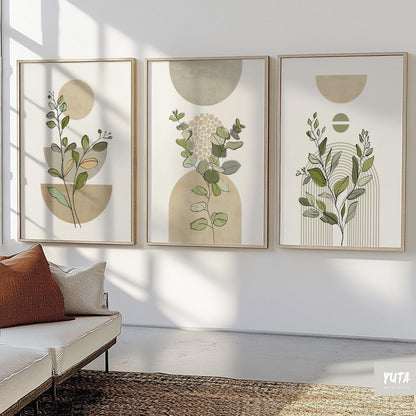 Set of three framed sage green botanical prints in boho mid-century style above a console.
