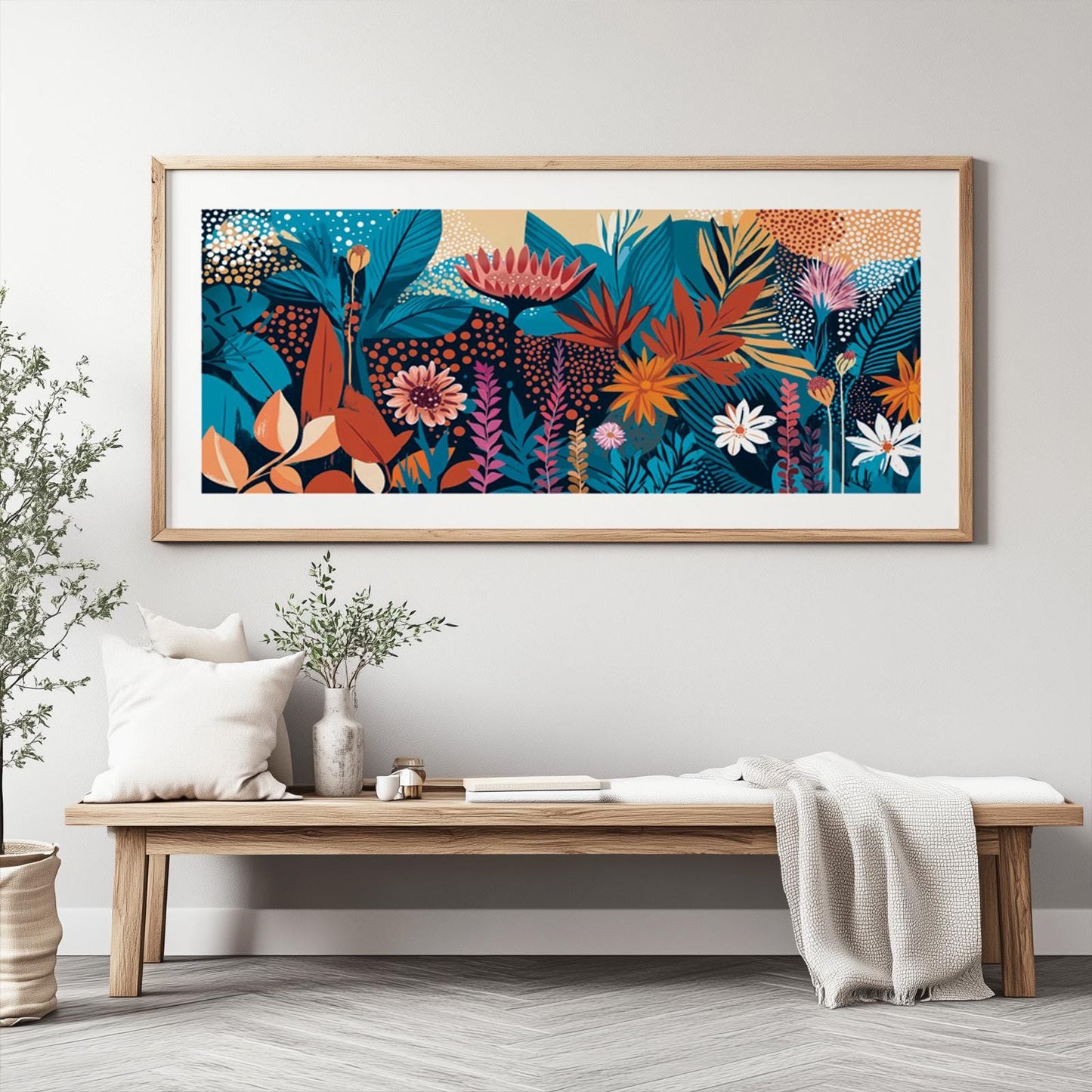 Vivid abstract floral artwork in a light wood frame displayed above a minimalist bench
