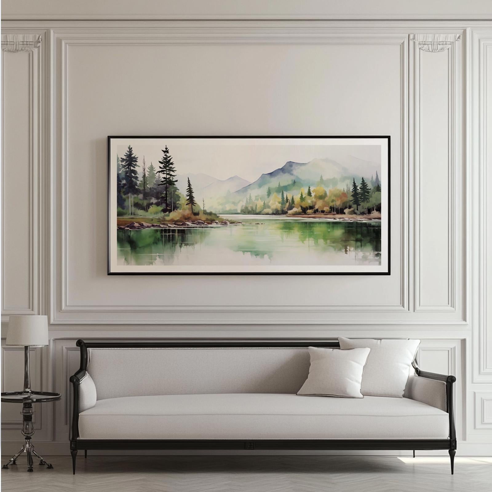 Framed watercolor forest landscape artwork displayed above a white upholstered sofa