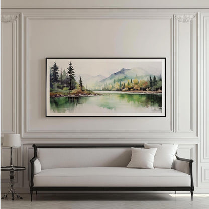 Framed watercolor forest landscape artwork displayed above a white upholstered sofa