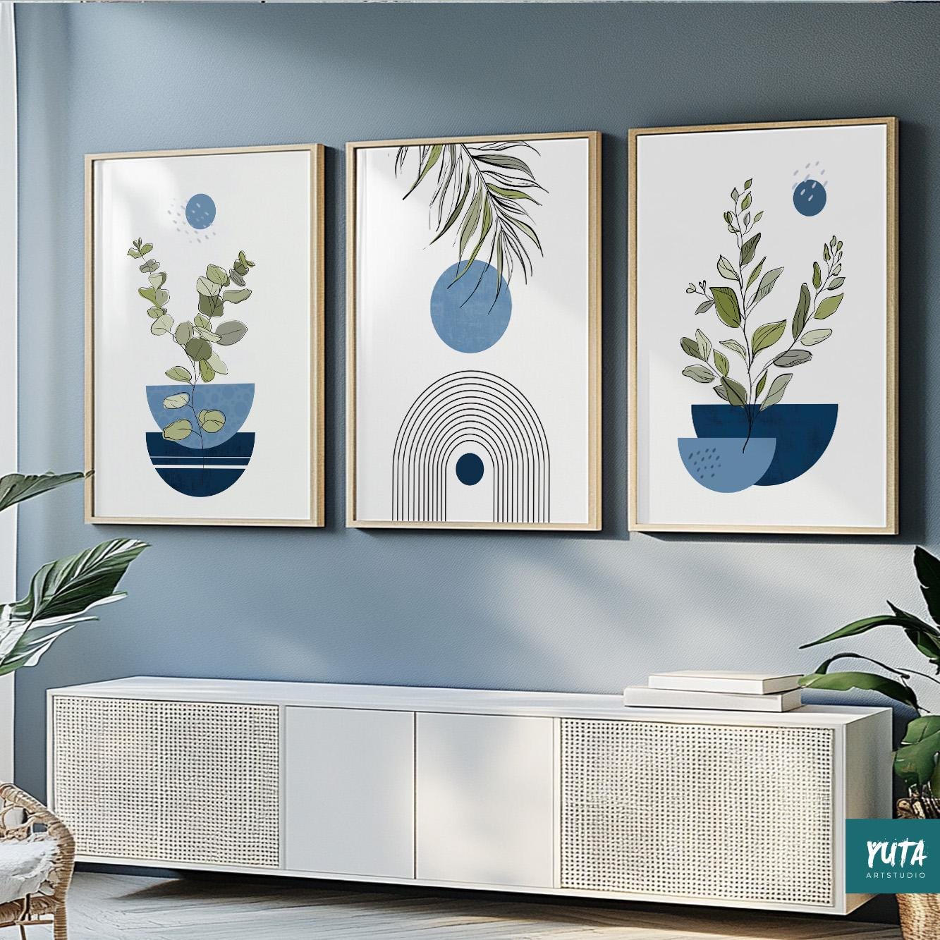 Three framed navy blue abstract prints with botanical and geometric motifs in a linear gallery arrangement