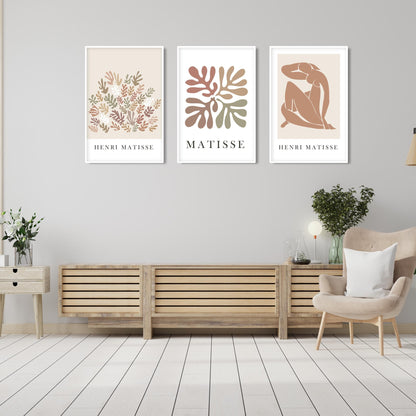 Three framed neutral Matisse prints in 20x28 inch sizes displayed side by side above a wooden sideboard.