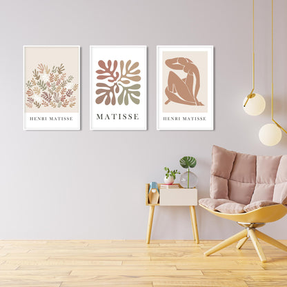 Trio of framed beige Matisse prints in a mid-century style, highlighted by soft daylight.