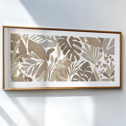 Tropical botanical artwork in soft beige tones, framed in gold and hung on a white wall